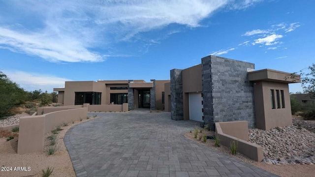 adobe home featuring a garage