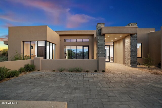 pueblo revival-style home with a mountain view