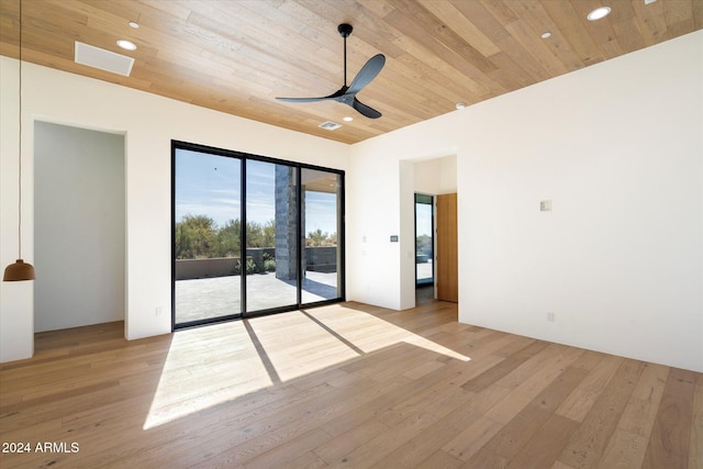 spare room featuring light wood-style floors, wood ceiling, and ceiling fan