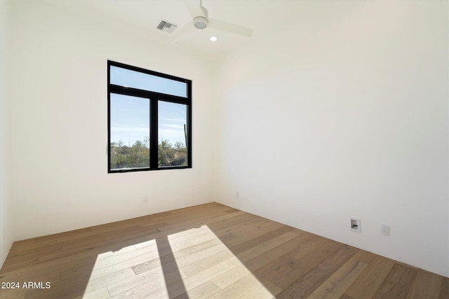 unfurnished room featuring ceiling fan and light wood-type flooring