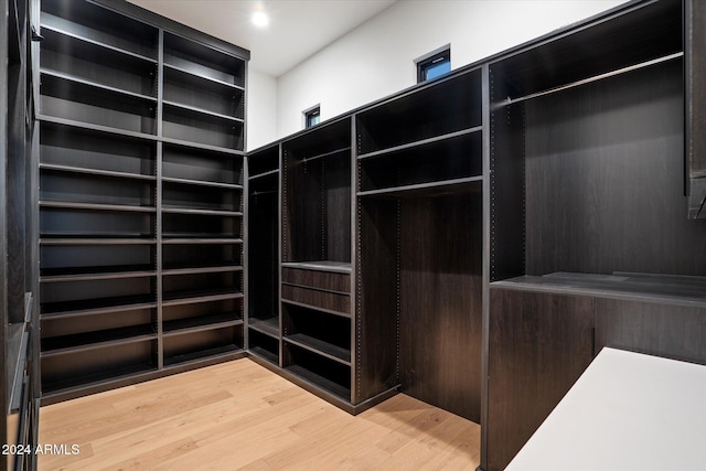 walk in closet featuring wood finished floors