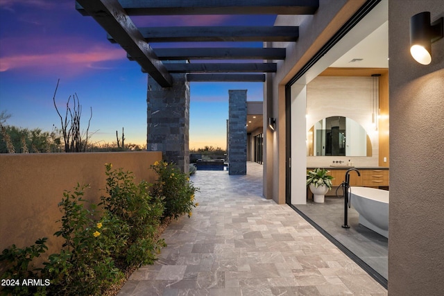 view of patio / terrace featuring fence and a pergola