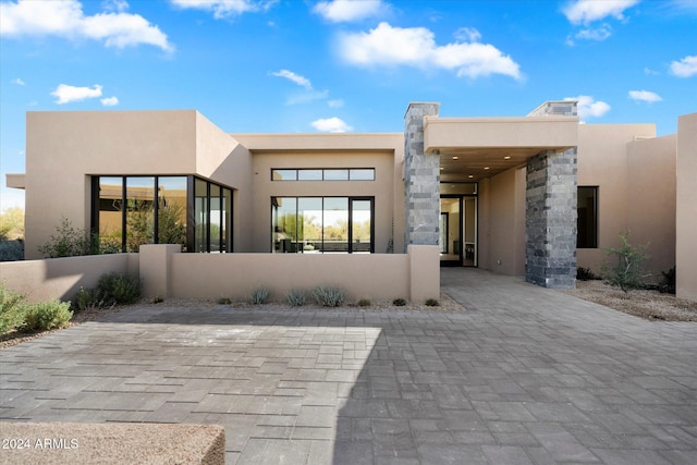 rear view of house with a carport