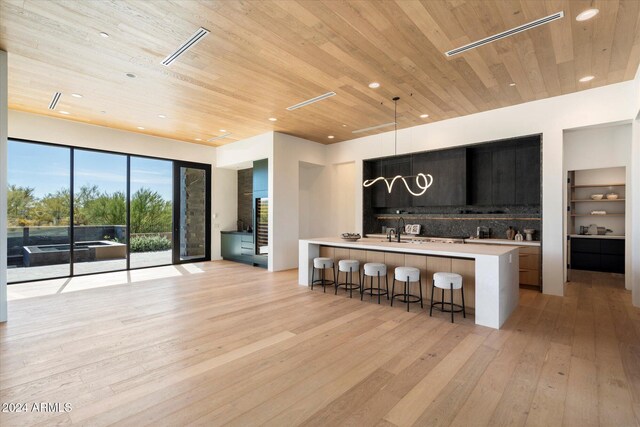 back of property with a mountain view and a patio area