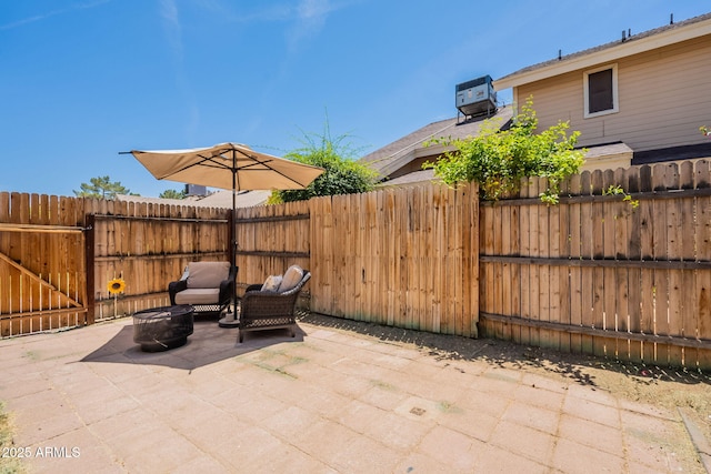 2455 E Broadway Rd Unit 115, Mesa, AZ 85204 - fenced backyard featuring a patio, an outdoor fire pit, and cooling unit