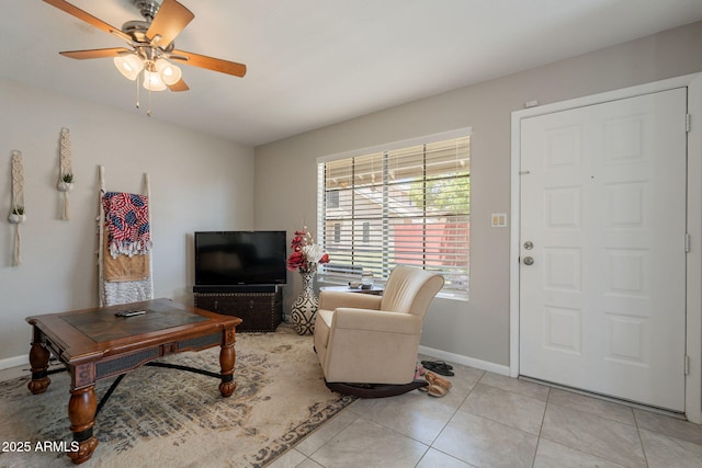 2455 E Broadway Rd Unit 115, Mesa, AZ 85204 - living room with a ceiling fan, baseboards, and light tile patterned floors
