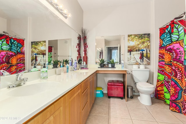 bathroom with tile patterned floors, vanity, and toilet