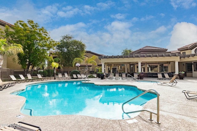 view of swimming pool with a patio