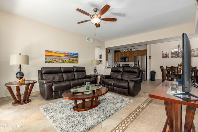 living room with ceiling fan and light tile patterned floors