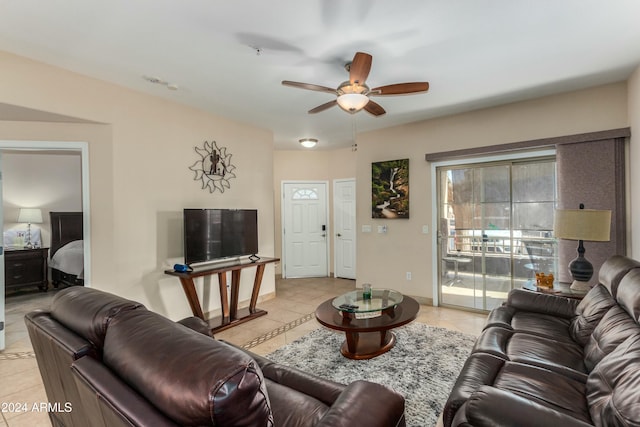 living room with ceiling fan and light tile patterned floors