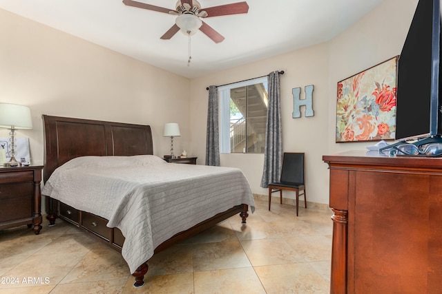 bedroom featuring ceiling fan and light tile patterned flooring