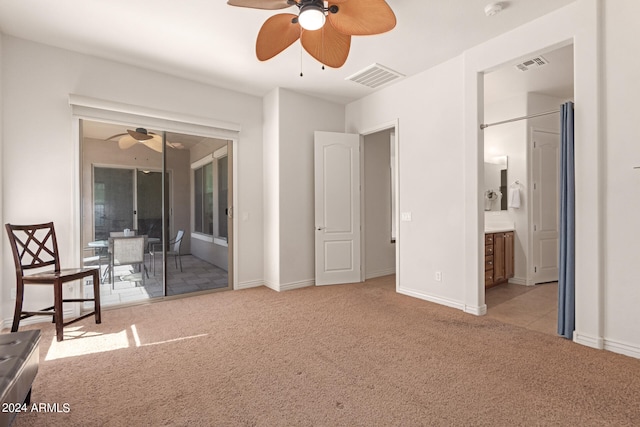 bedroom featuring light carpet, ensuite bath, access to exterior, and ceiling fan