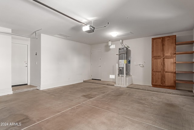 garage with a garage door opener and water heater