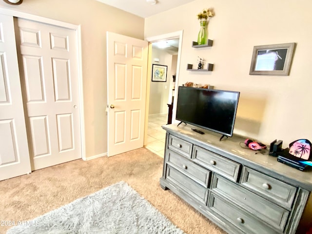 bedroom featuring light colored carpet