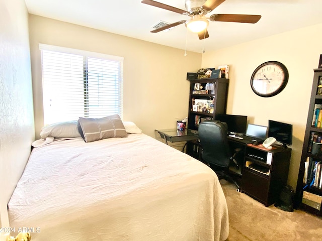 bedroom with light carpet and ceiling fan