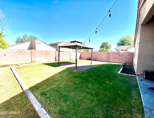 view of yard with a gazebo and a patio area