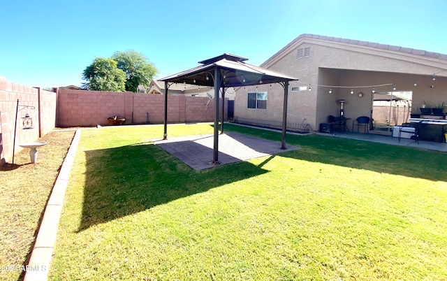 view of yard featuring a patio and a gazebo