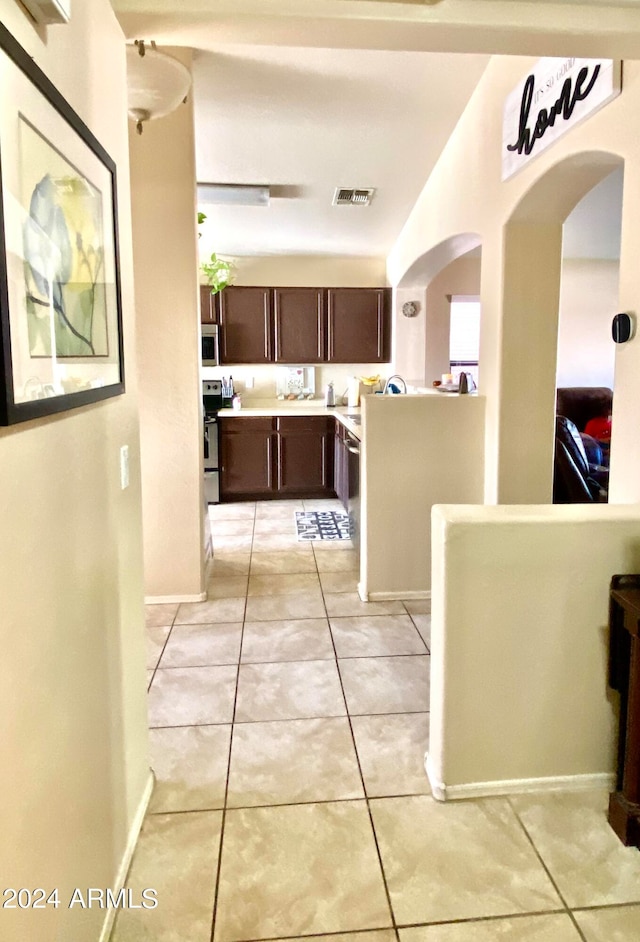 hallway with light tile patterned floors