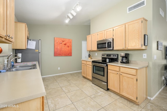8331 E Plata Ave, Mesa, AZ 85212 - kitchen with a sink, stainless steel appliances, light brown cabinets, visible vents, and baseboards