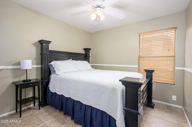 8331 E Plata Ave, Mesa, AZ 85212 - bedroom with light tile patterned floors, ceiling fan, and baseboards