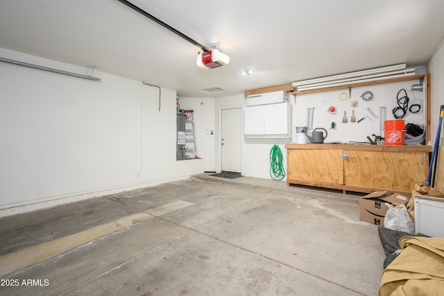 8331 E Plata Ave, Mesa, AZ 85212 - garage with a garage door opener and a workshop area