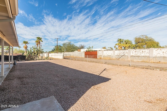 view of yard with a fenced backyard and a patio