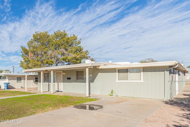 single story home featuring fence, a patio, and a front yard