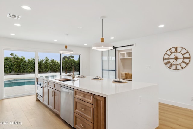 8403 E Fairmount Ave, Scottsdale, AZ 85251 - kitchen with dishwasher, a sink, light wood finished floors, recessed lighting, and a kitchen island with sink