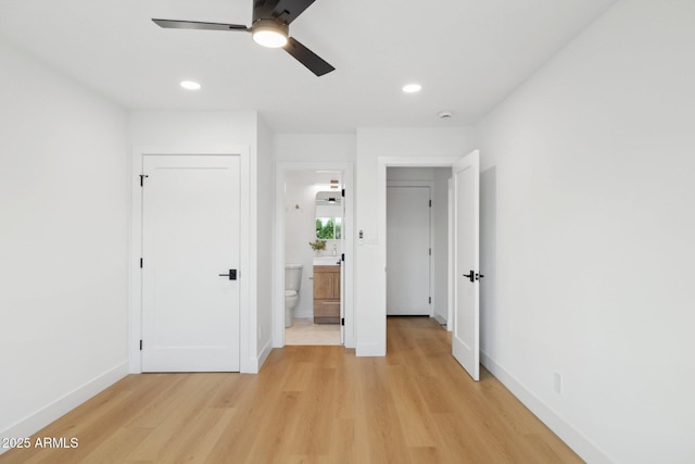 8403 E Fairmount Ave, Scottsdale, AZ 85251 - unfurnished bedroom with light wood-type flooring, baseboards, recessed lighting, ensuite bathroom, and ceiling fan