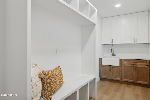 8403 E Fairmount Ave, Scottsdale, AZ 85251 - mudroom featuring a sink, light wood finished floors, and recessed lighting