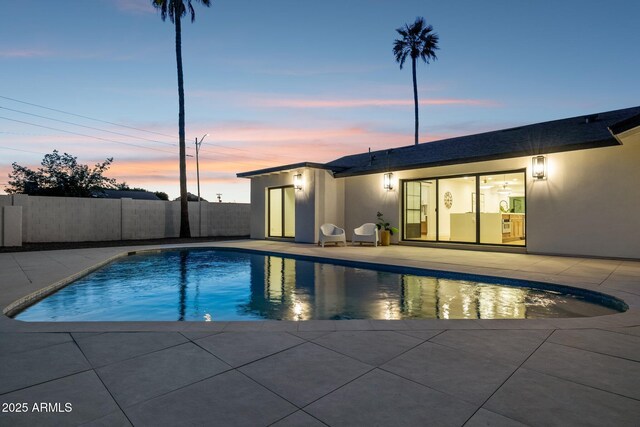 8403 E Fairmount Ave, Scottsdale, AZ 85251 - pool at dusk featuring a patio area
