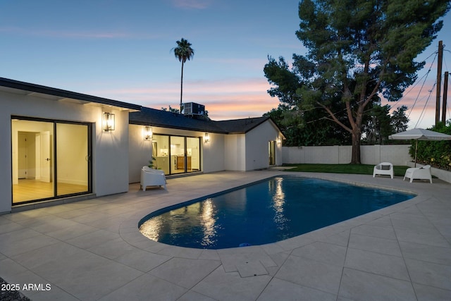 8403 E Fairmount Ave, Scottsdale, AZ 85251 - pool at dusk featuring a patio