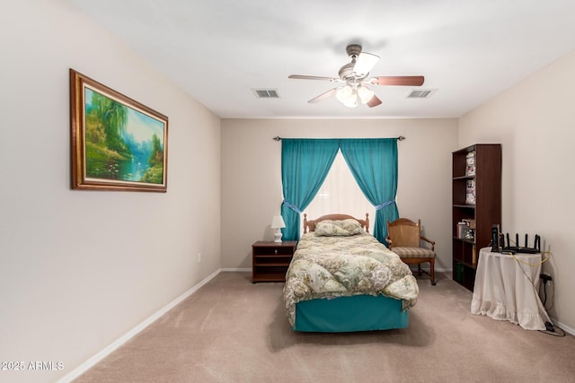 carpeted bedroom with baseboards, visible vents, and ceiling fan