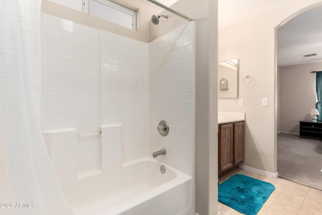 bathroom with visible vents, baseboards, tile patterned floors, shower / bathtub combination with curtain, and vanity