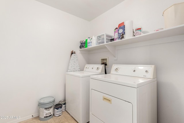 laundry area featuring laundry area, independent washer and dryer, and baseboards