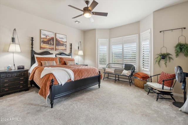 bedroom featuring ceiling fan and light colored carpet