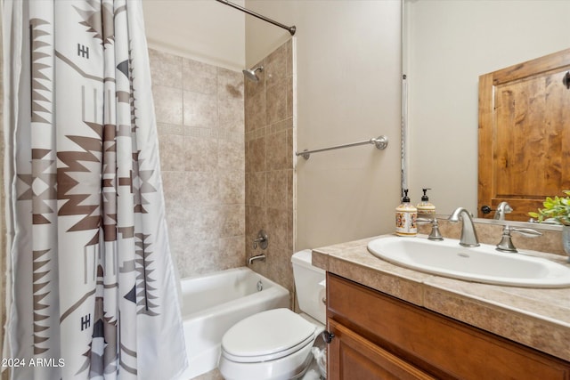 full bathroom featuring shower / bathtub combination with curtain, toilet, and vanity