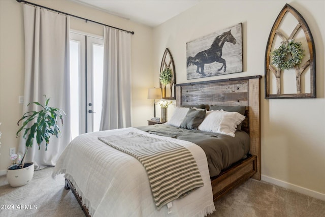 bedroom featuring light carpet