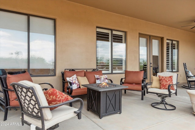 view of patio / terrace featuring an outdoor living space with a fire pit and ceiling fan