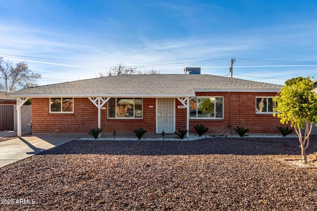 ranch-style home with a carport