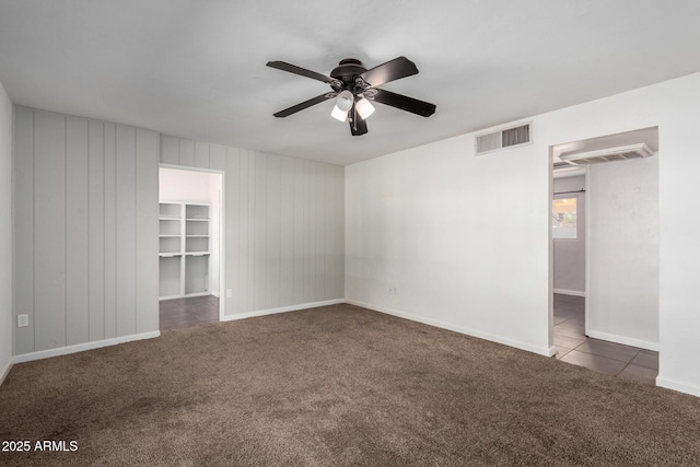 carpeted empty room with ceiling fan