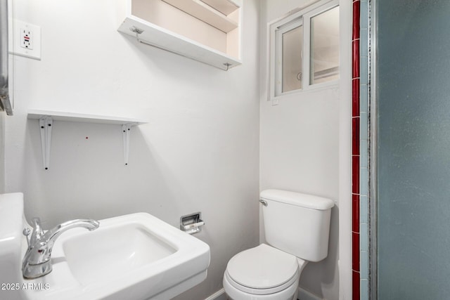 bathroom featuring sink and toilet