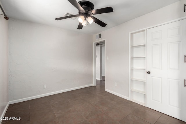 unfurnished bedroom with a closet and ceiling fan