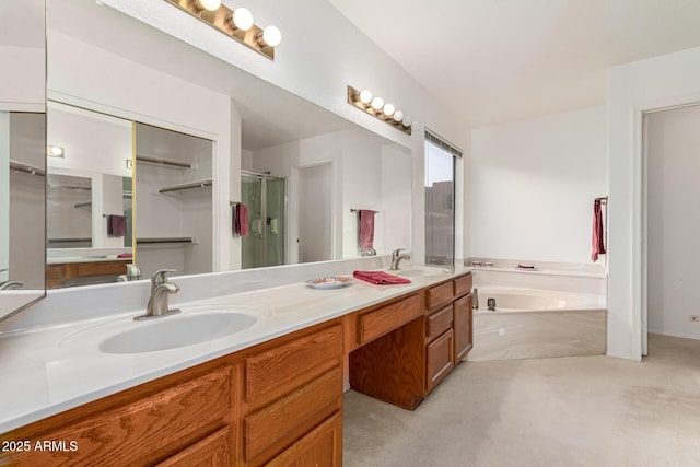 bathroom featuring vanity and separate shower and tub