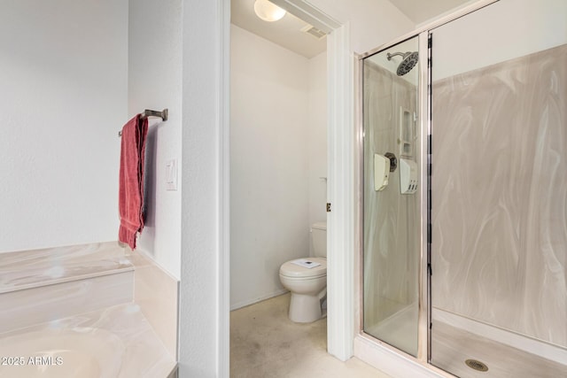 bathroom with walk in shower and toilet