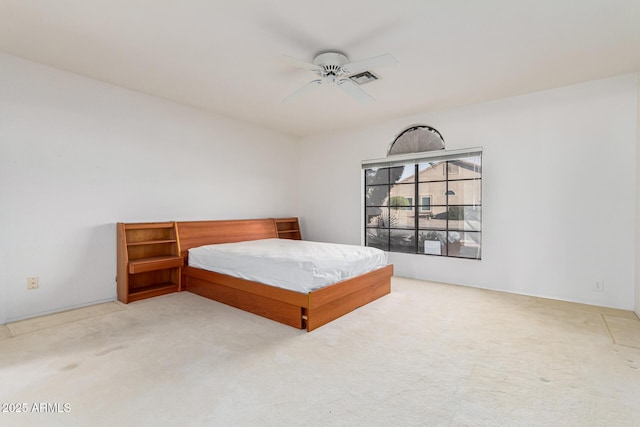 bedroom featuring ceiling fan and light colored carpet