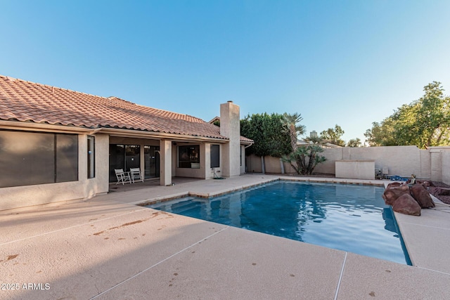 view of swimming pool featuring a patio area