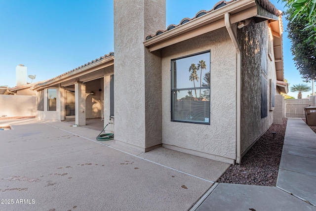 rear view of property featuring a patio area