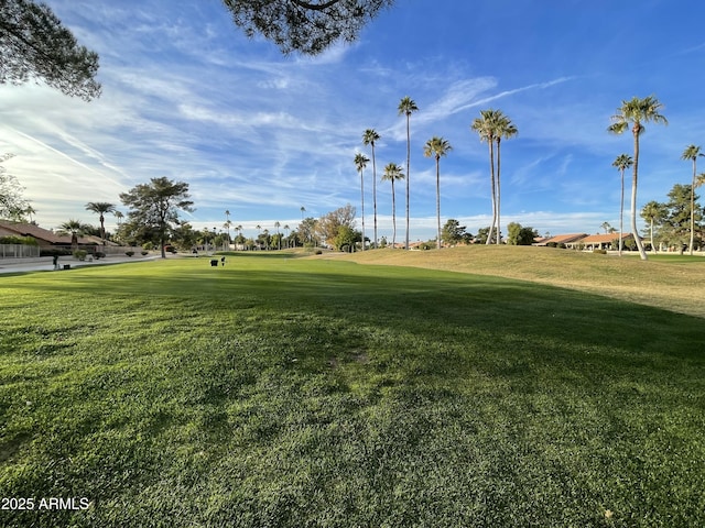 view of home's community featuring a lawn