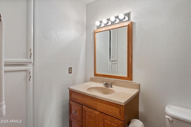 4333 E Desert Cactus St, Phoenix, AZ 85032 - bathroom featuring toilet, vanity, and a textured wall